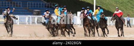 A traditional game of Kok Boru during the Third World Nomad Games 2018 in Cholpon-Ata, Kyrgyzstan. Here the Kazach team competing against the Russian Stock Photo