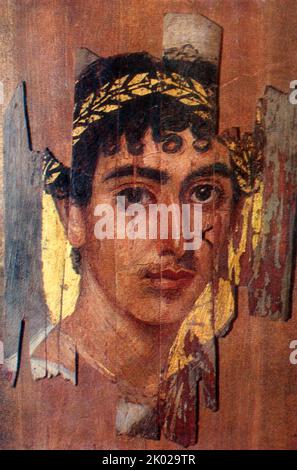 Portrait of a young man in a gold wreath, portrait of the Fayum mummy, Romano-Egyptian, early 2nd century. Stock Photo