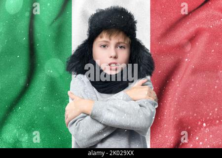 Cold winter and consequences of gas sanctions, consequences of the war in Ukraine, shortage of gas and heat in Italy, a European schoolboy boy is free Stock Photo