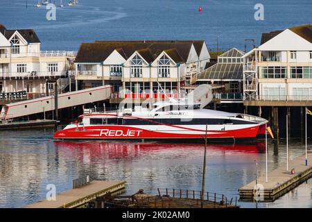 Red Jet 7, catamaran foot passenger ferry to the Isle of Wight of the Red Funnel line, berthed at T2 terminal, Southampton, Hampshire. Stock Photo
