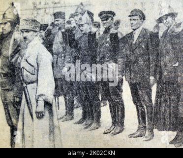 Revolutionary Military Council of the Caucasian Front hosts a military parade of the 11th army of Baku after the liberation. Front row (left to right): G.K. Ordzhonikidze, A.I. Mehanoshin, M.K. Levandovskiy, S.M.Kirovm F. Tartakovaskaya. May, 1920. Stock Photo
