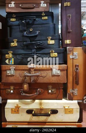 Vertical stack of vintage suitcases Stock Photo