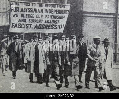 Workers in England at a protest against the Italian fascist attack on Ethiopia. London. 1935. Stock Photo