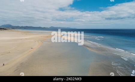 Beautiful nature landscape viewed from air with yellow sand tropical beach and blu ocean and sky. Tourist scenic place and travel destination for summer holiday vacation Stock Photo