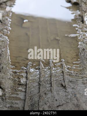 Close up of lorry tire track with mud water Stock Photo