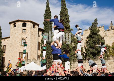 Castellers performing in Plaza Octavia in Sant Cugat del Valles in the province of Barcelona in Catalonia Spain Stock Photo