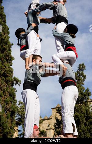 Castellers performing in Plaza Octavia in Sant Cugat del Valles in the province of Barcelona in Catalonia Spain Stock Photo