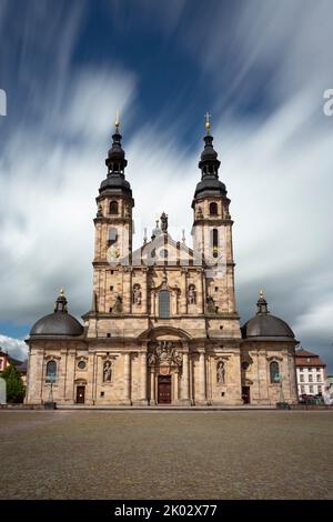 Germany, Hesse, Eastern Hesse, Rhön, Fulda, Cathedral of Fulda, Cathedral St. Salvator, High Cathedral of Fulda, Cathedral Church of the Diocese of Fulda on sunny day, with running clouds in the background, long exposure Stock Photo