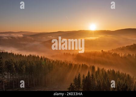 Germany, Thuringia, Großbreitenbach, Wildenspring, landscape, forest, valleys, mountains, sunrise, back light Stock Photo