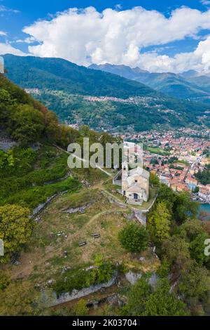 Aerial view of the church of Sant'Eufemia in Musso overlooking Lake Como. Musso, Como district, Lake Como, Lombardy, Italy. Stock Photo