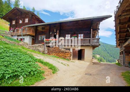 Mountain farm on the steep slope in the South Tyrolean Ulten Valley Stock Photo