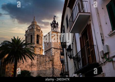 view of spanish town of Sitges landmark building of the Ajuntament, known as Casa de la Vila, at sunset with dramatic light Stock Photo