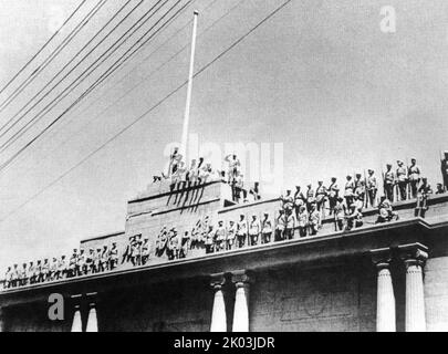 A Group of Soldiers Standing in Front of the Office of the President of China after the communist takeover in October 1949 Stock Photo