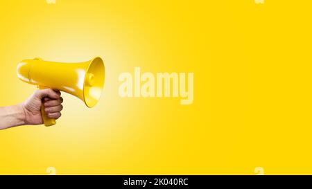On a bright yellow background, a yellow megaphone. Election debates, rumors, gossip, false information, journalism. There are no people in the photo. Stock Photo