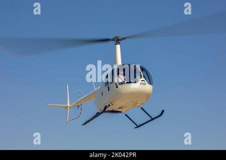 A helicopter flying in the sky Stock Photo
