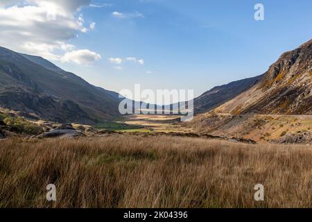 A view of Nant Ffrancon with the slate tips of Penrhyn Quarry at the far end, Snowdonia National Park Stock Photo