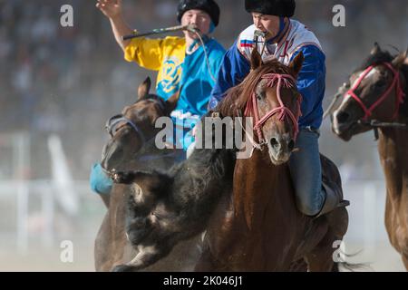 A traditional game of Kok Boru during the Third World Nomad Games 2018 in Cholpon-Ata, Kyrgyzstan. Here the game between Russia and Kazachstan. Buzkas Stock Photo