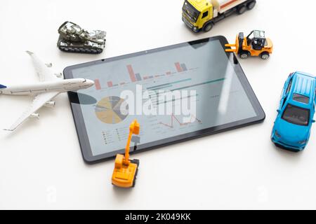 Tablet computer with different types of toy transport. auto center Stock Photo