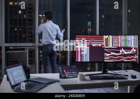 Chinese businessman working in office at night