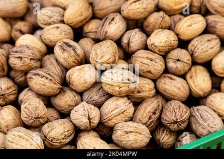 Walnuts in shells at the food market in Bärenplatz and Bundesplatz, Bern, Switzerland Stock Photo