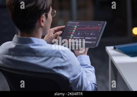 Chinese businessman working in office at night Stock Photo