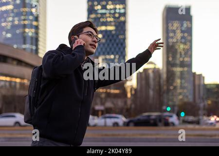 Chinese IT worker talking on cell phone Stock Photo