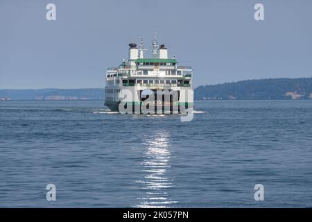 Mukilteo, WA, USA - September 02, 2022; Washington State Ferry Tokitae with sunlight reflecting in the water Stock Photo