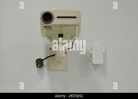 Projector hanging on the wall Stock Photo