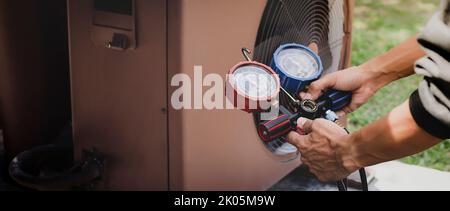 Air condition outdoor unit compressor install outside the house,Condenser unit in central air conditioning systems. Stock Photo