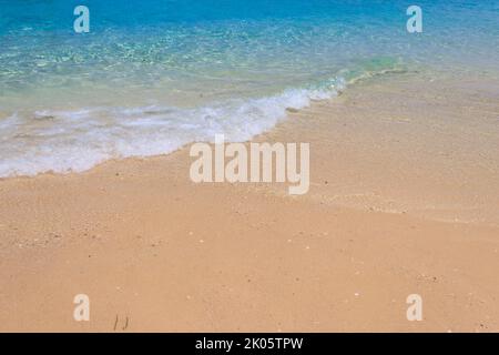 Soft wave of ocean on sandy beach Stock Photo