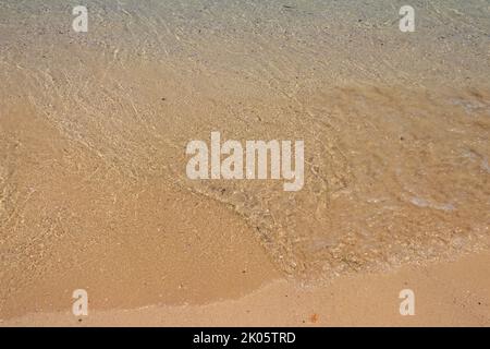 Soft wave of ocean on sandy beach Stock Photo
