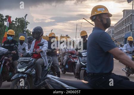 Konawe, Indonesia. 09th Sep, 2022. PT. OSS workers prepare to return to their respective homes after the end of their shifts in Konawe. A smelter company in Morosi sub-district, Konawe, Southeast Sulawesi, namely PT. VDNI and PT. OSS are mining areas and become one of the national vital objects. (Photo by Andry Denisah/SOPA Images/Sipa USA) Credit: Sipa USA/Alamy Live News Stock Photo