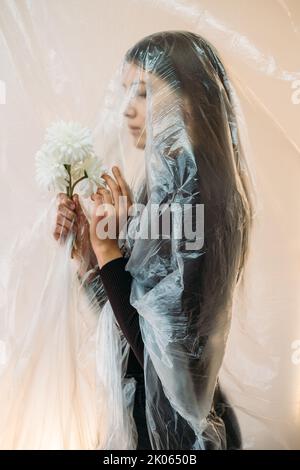 defocused profile portrait sad woman air pollution Stock Photo