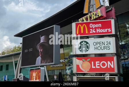 Service stations around the country show signage/screens as a tribute to The Queen as as period of mourning for The Queen begins. Photo shows Beaconsfield Services on the M40. Stock Photo