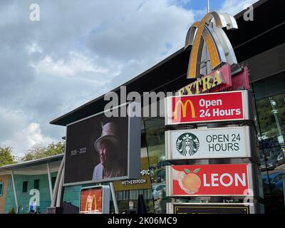 Service stations around the country show signage/screens as a tribute to The Queen as as period of mourning for The Queen begins. Photo shows Beaconsfield Services on the M40. Stock Photo