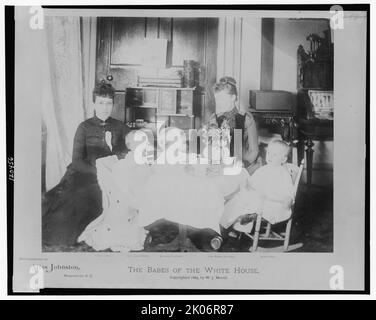 The babes of the White House, c1889. Mrs. McKee, Mary Lodge McKee, Marthena Harrison, Mrs. Russell Harrison, and Baby McKee (Benjamin Harrison McKee), seated around table. Stock Photo