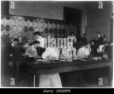 Students in a science class using microscopes, Western High School, Washington, D.C., (1899?). Stock Photo