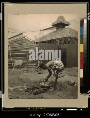 In darkest Africa, 1901. Photograph shows an African woman washing clothes at the Pan-American Exposition, Buffalo, N.Y. Stock Photo