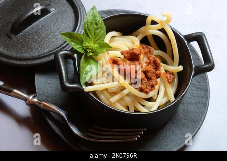 Pici pasta with Bolognese sauce in pots, pasta, pasta Stock Photo