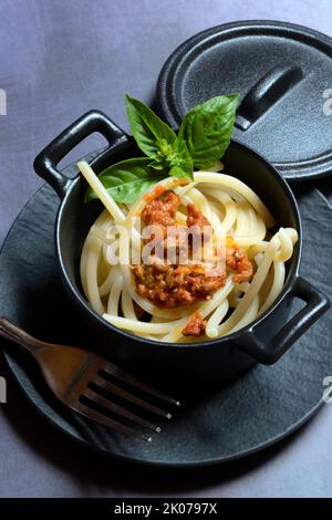 Pici pasta with Bolognese sauce in pots, pasta, pasta Stock Photo