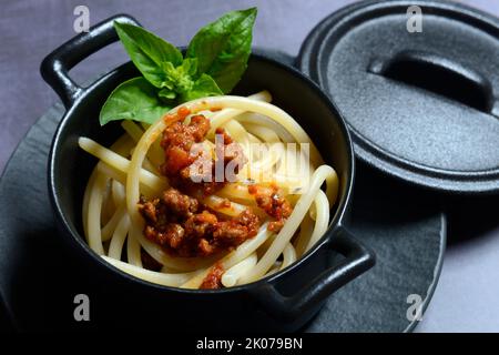 Pici pasta with Bolognese sauce in pots, pasta, pasta Stock Photo