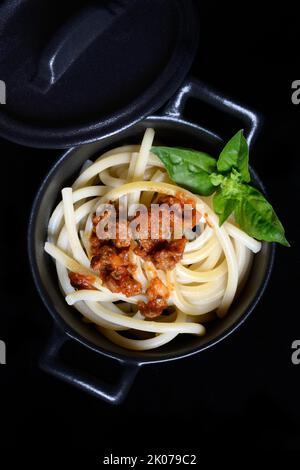 Pici pasta with Bolognese sauce in pots, pasta, pasta Stock Photo