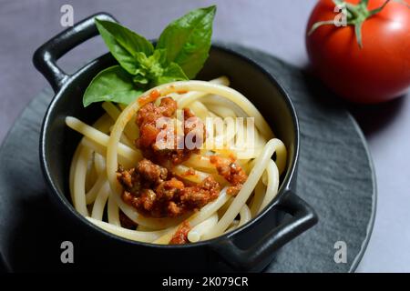 Pici pasta with Bolognese sauce in pots, pasta, pasta Stock Photo