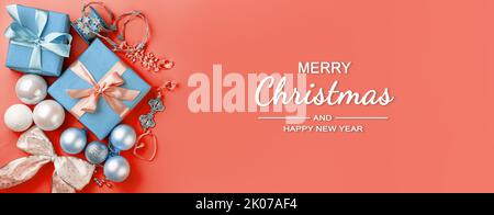 Christmas background with gifts, ribbons and toys. The concept of Christmas and New Year. Top view, horizontal Stock Photo