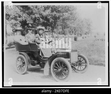 Frances Benjamin Johnston seated with three other people in automobile, between 1890 and 1910. Stock Photo