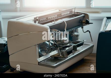 Repairing of coffee machine in workshop. View inside Stock Photo