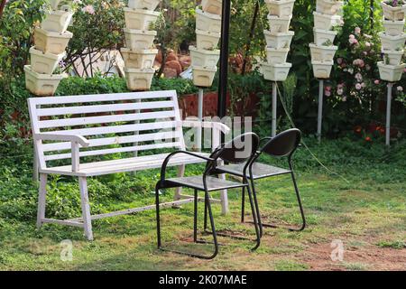 empty bench and chair from garden a tranquil place for work from home Stock Photo