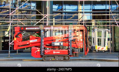 Hinowa Light Lift 1 Remote Controlled, Self Propelled Tracked Cherry Picker scaffolding background Stock Photo