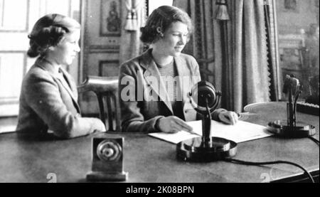 Princess Elizabeth rehearses her first broadcast as her sister Princess Margaret looks on. Elizabeth II (Elizabeth Alexandra Mary; born 21 April 1926) is Queen of the United Kingdom and 14 other Commonwealth realms Stock Photo