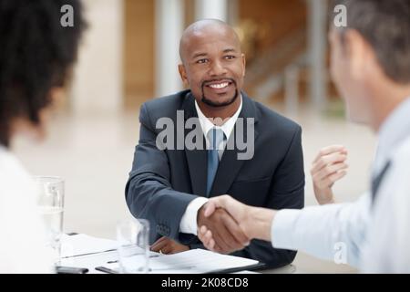 The perfect partnership. Two business executives shaking hands in agreement. Stock Photo